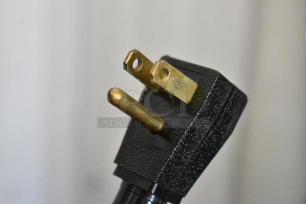 Close-up of a power plug for a 2024 True T-35 commercial cooler, indicating 115 volts, 1 phase.