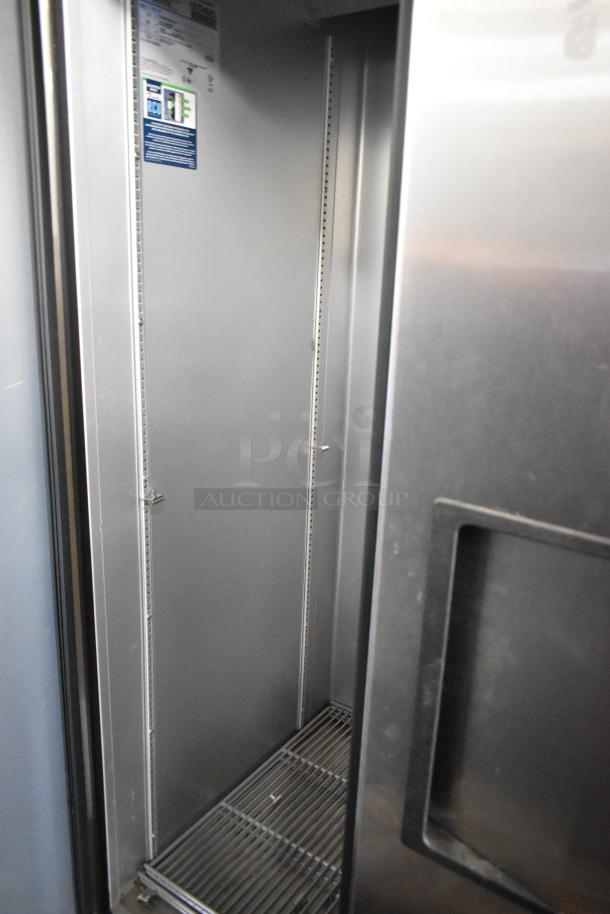2024 True T-35 stainless steel 2-door reach-in cooler with poly-coated racks and commercial casters, shown open.