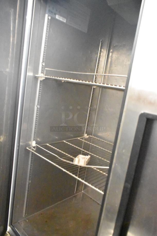 Turbo Air TSF-49SD stainless steel commercial freezer interior view, showing poly-coated wire racks. 115V, 1 Phase.