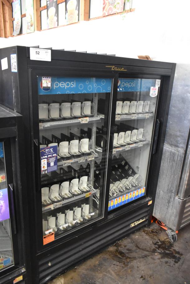True GDM-41SL-60-LD commercial cooler, 2 glass doors, poly-coated racks, Pepsi signage, auction tag. 115V, 1 phase.