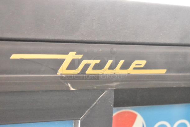 True GDM-41SL-60-LD cooler with poly coated racks, 2 doors, 115V, 1 phase, slight surface wear, logo visible.