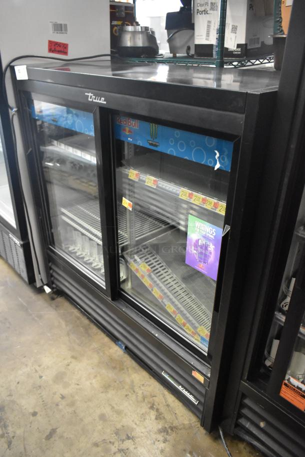 2019 True GDM-41SL-48-HC-LD commercial 2-door cooler, black, with glass sliding doors and poly-coated racks, 115V.