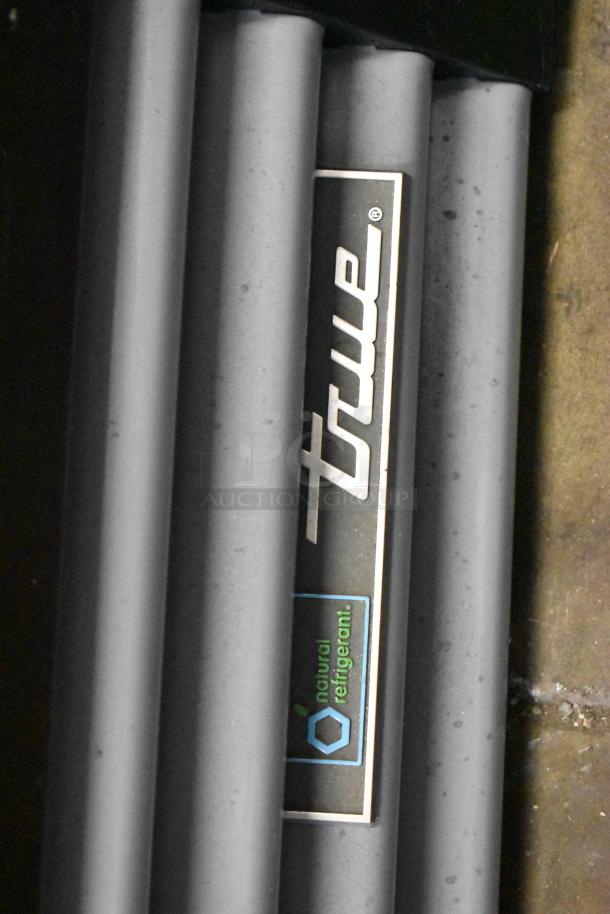 2020 True GDM-12-HC cooler label, featuring "True" logo and "natural refrigerant" text, indicating eco-friendly cooling.