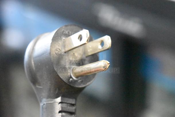 Close-up of a three-prong electrical plug for the 2020 Habco GDM-12-HC single door reach-in cooler.