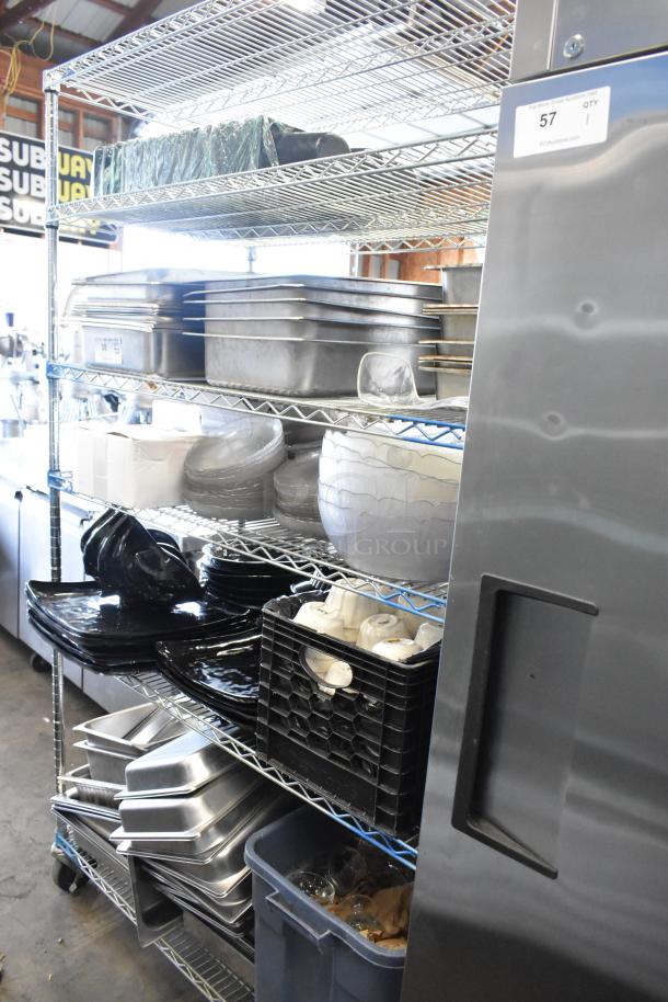 Auction lot of various items, including stainless steel drop-in bins, chafer lids, salad plates, and bowls. Shelves not included.