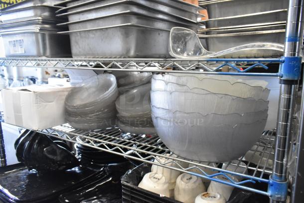 Metro lot includes stainless steel drop-in bins, chafer lids, salad plates, and salad bowls on metal shelving.