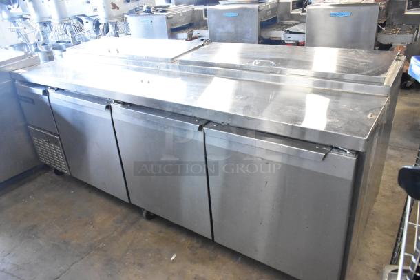2018 Continental CPA93 stainless steel commercial pizza prep table, three doors, casters, 115 volts, 1 phase.