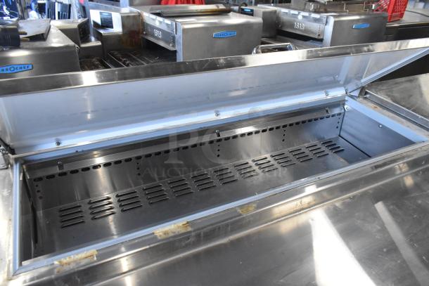 2018 Continental CPA93 stainless steel commercial pizza prep table, clean interior, on commercial casters, 115V, 1 phase.
