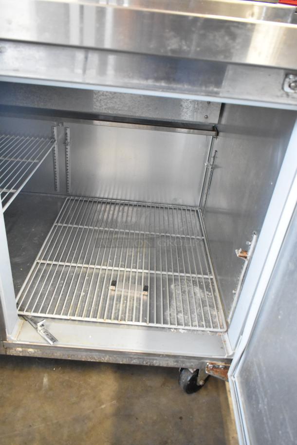 2018 Continental CPA93 stainless steel pizza prep table with shelves, commercial casters. 115 Volts, 1 Phase.