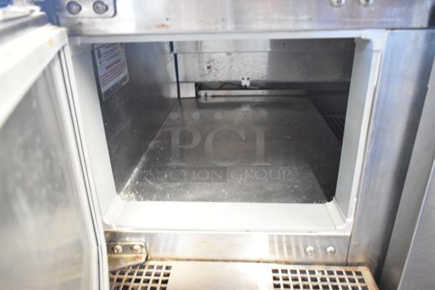 2018 Continental CPA93 Stainless Steel Pizza Prep Table, 115V, 1 Phase, with commercial casters, interior view.