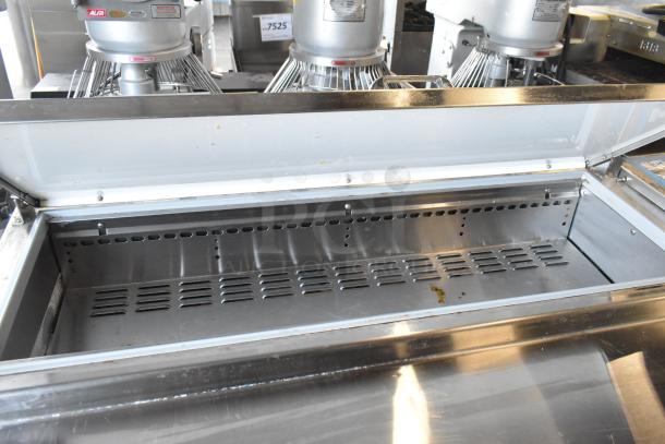 2018 Continental CPA93 stainless steel commercial pizza prep table with open lid, showing interior. On casters, 115V, 1 phase.