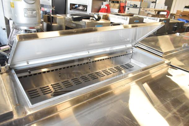 2018 Continental CPA93 stainless steel commercial pizza prep table with open top, on casters, 115 volts, 1 phase.
