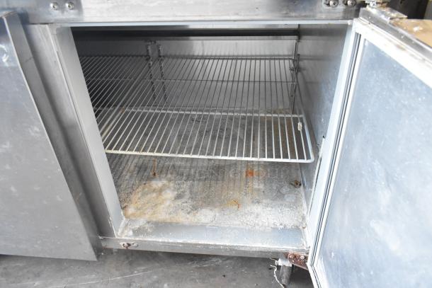 2018 Continental CPA93 stainless steel pizza prep table, used condition, on commercial casters, 115 volts, 1 phase.