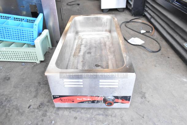 Two metal countertop food warmers, including Vollrath 1001 and Avantco 177W43. 115 volts, 1 phase. Visible wear.