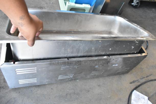 2 metal commercial countertop food warmers, Vollrath 1001 and Avantco 177W43, 115V, used condition, includes lids.