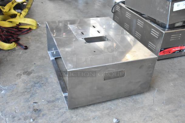 Metal wall-mount shelf with frame, silver finish, showing slight wear. Includes two poly silverware caddies. Auction item.