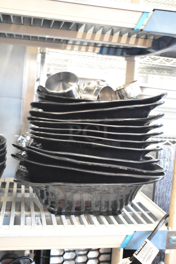 Two-tier lot with stack of black bowls and ChefMaster single burner butane range. Items appear in good condition.