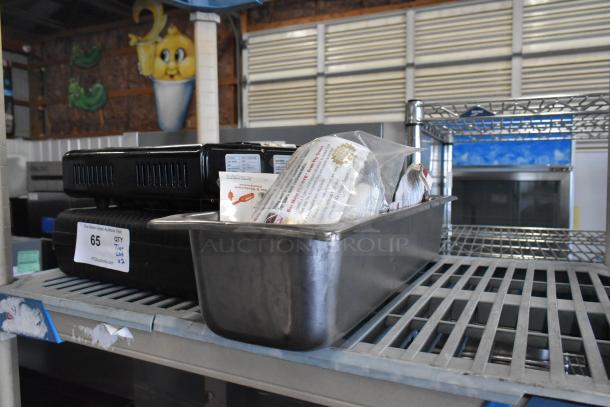 Two-tier auction lot with black bowls, ChefMaster single burner butane range, metal containers. Includes tags and labels.