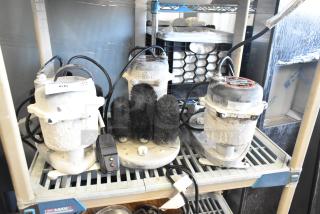 Three Bar Maid electric glass washers on a shelf. Features multiple black brushes. Operates at 115 volts, 1 phase. Includes power cords.