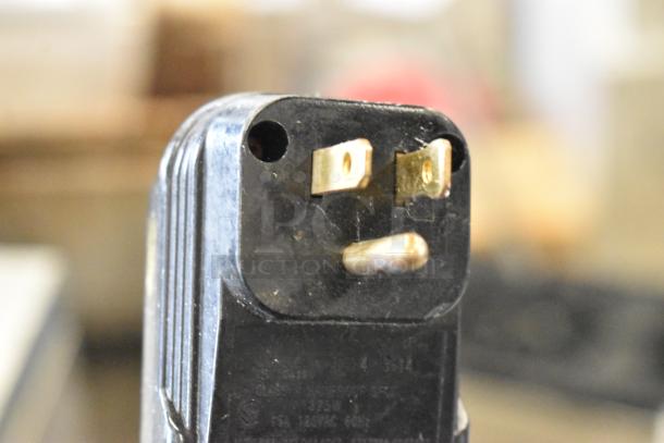 Close-up of a 3-prong plug for Bar Maid Electric Glass Washer, 115V, 1 Phase. Black casing shows light wear.