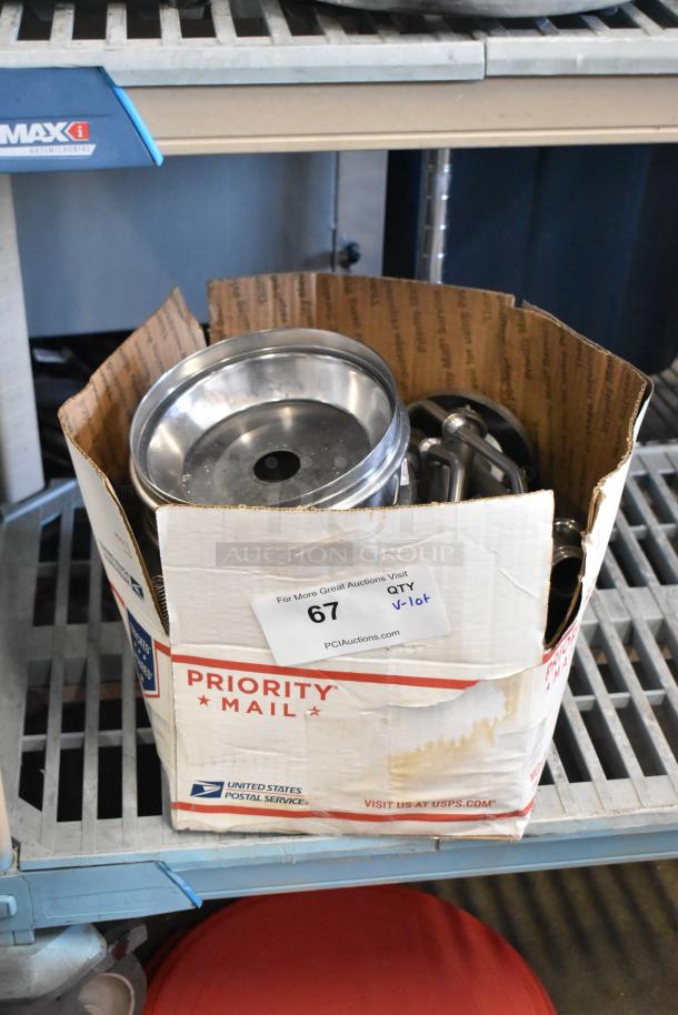 Lot of various items, including server pump parts, in a USPS Priority Mail box. Box labeled with auction tag number 67.