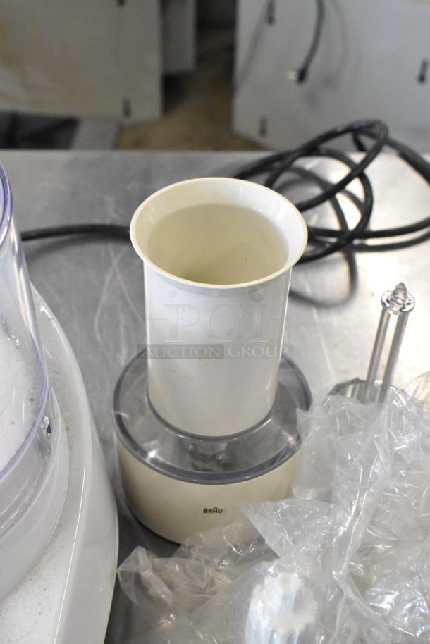 Waring food processor with 2 S blades, 6 slicing blades, and 1 grating blade, 120 volts, 1 phase. Slightly worn condition.