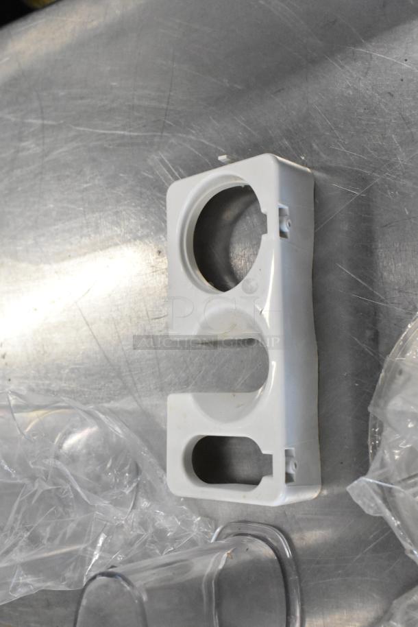 Waring food processor component, white plastic, designed to hold blades. Suitable for 120 volts, 1 phase appliances.
