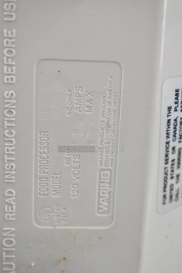 Waring food processor, model FP25, 120V, includes 2 S blades, 6 slicing blades, 1 grating blade; label detail shown.