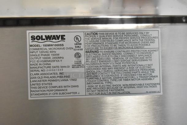 2024 Solwave 180MW1000SS stainless steel commercial microwave oven label, 120V, 1000W output. Model, serial, and safety info visible.