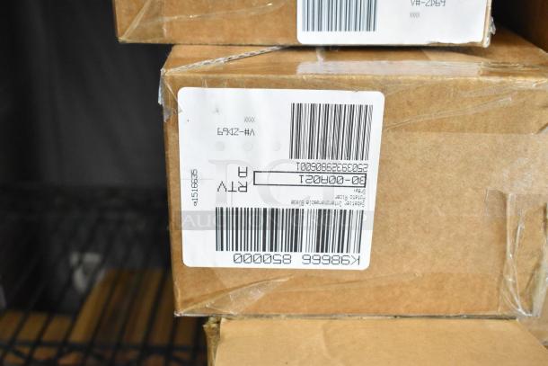 Six boxes of brand new Copco Rinse and Store Multi-Function Storage Bins and Potato Ricer Blades. Labels with barcodes visible.
