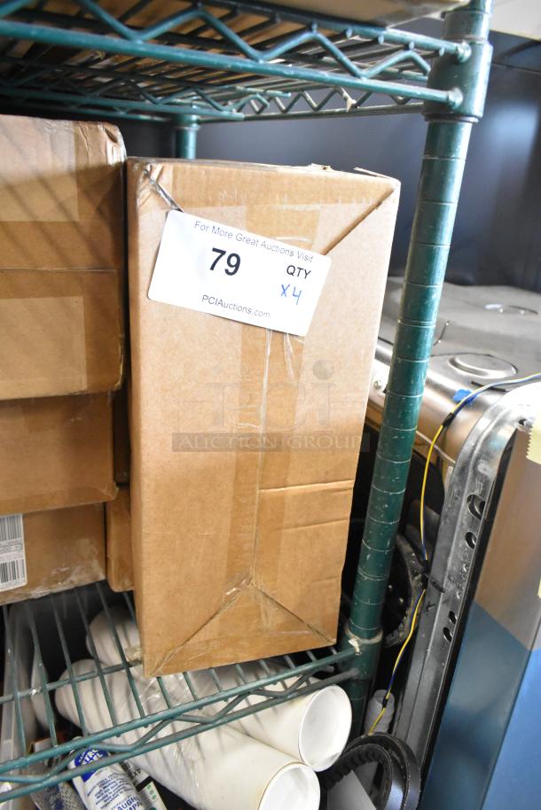 Four boxes of new items, labeled "79 QTY 4", containing interchangeable blades for potato ricers.
