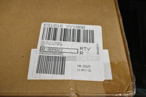 9 boxes of brand new items with labels indicating stackable storage drawers and gravity-feed egg dispensers.