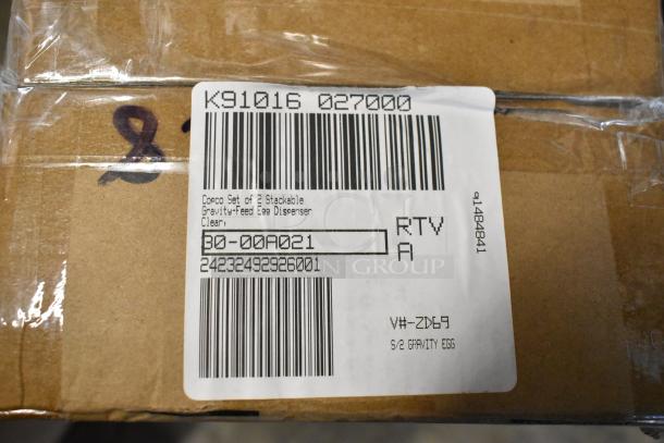 Brown cardboard box with a label reading "Copco Set of 2 Stackable Gravity-feed Egg Dispenser, Clear." Includes barcodes and codes.