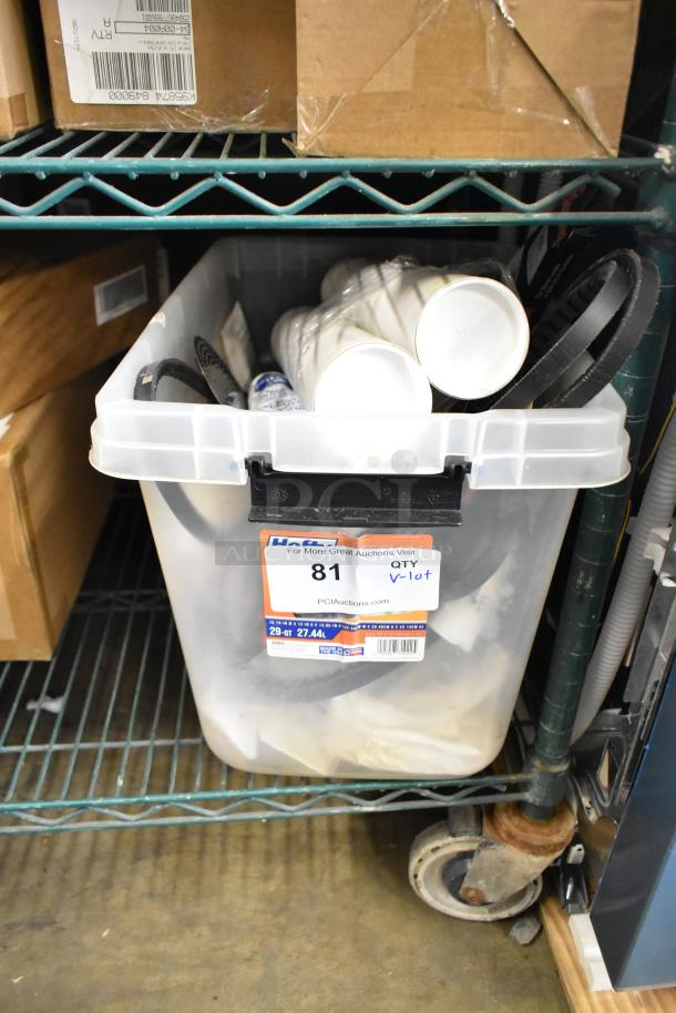 Container with assorted items, including belts and plastic pieces, on a shelf. Tag reads "Lot 81, QTY, V-lot, PCIAuctions.com."