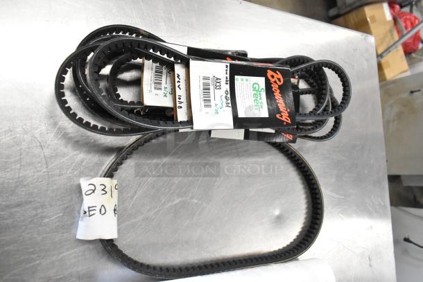 Lot of various V-belts including Browning brand; new condition, labels indicate model AX33, suitable for machinery use.