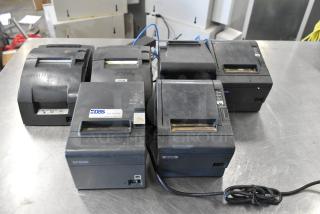 Six Epson receipt printers, varied models, used condition. Visible DBS label on one unit. Sold as a lot.