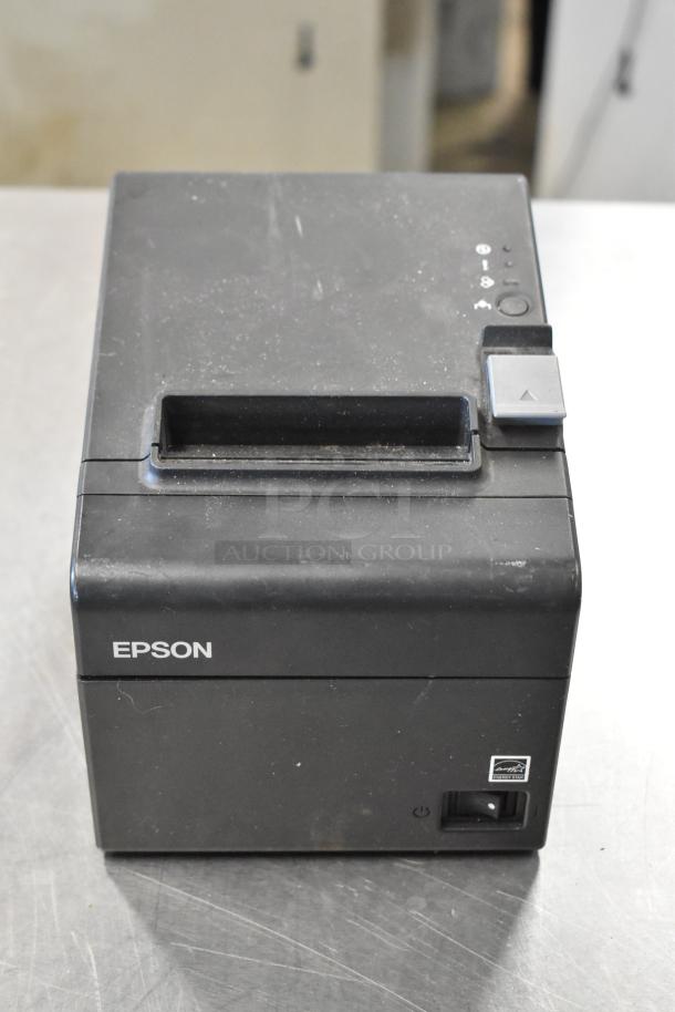 Epson receipt printer, black, visible power button, logo on front, minor wear, 6 available for auction.