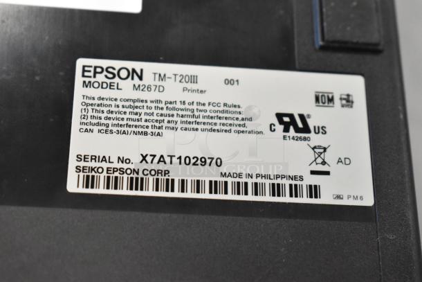 Close-up of Epson TM-T20III receipt printer label, model M267D, serial X7AT102970, made in Philippines.