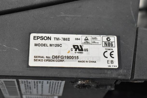 Epson TM-T88III receipt printer model M129C, serial D6FG190015, made in China, visible labels and markings.