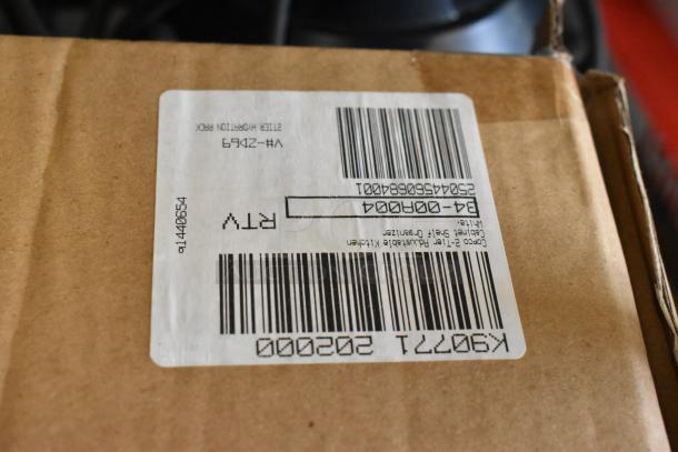Box with label showing product details for a tier lot of brand new items including an egg dispenser, storage drawer, and food chopper cup.