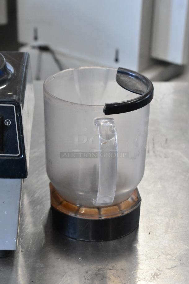 Hamilton Beach 990 Countertop Blender missing lid. Features 115 volts, 1 phase. Base and container shown; fair condition.