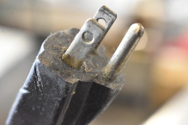 Close-up of a worn plug for the Hamilton Beach 990 Countertop Blender, missing lid. 115 volts, 1 phase. Shows dirt and wear.