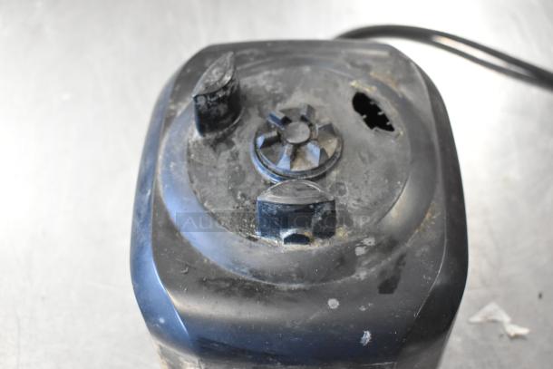 Hamilton Beach blender base, black, visible wear and damage, part of a lot with Cuisinart base and Nemco food warmer, 115V, 1 phase.