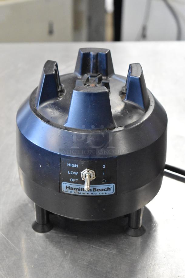 Hamilton Beach blender base with manual switch, marked for high and low settings. Commercial use, moderate wear visible.