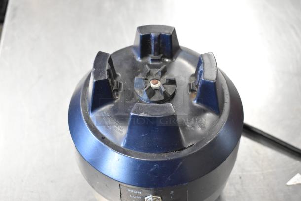 Hamilton Beach blender base, black, showing control panel with high and low settings. Surface wear visible. 115V, 1 phase.