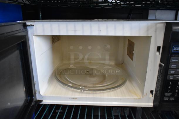 Sharp R-3A55 countertop microwave with glass plate. Includes control panel, 120 volts, 1-phase. Used condition.