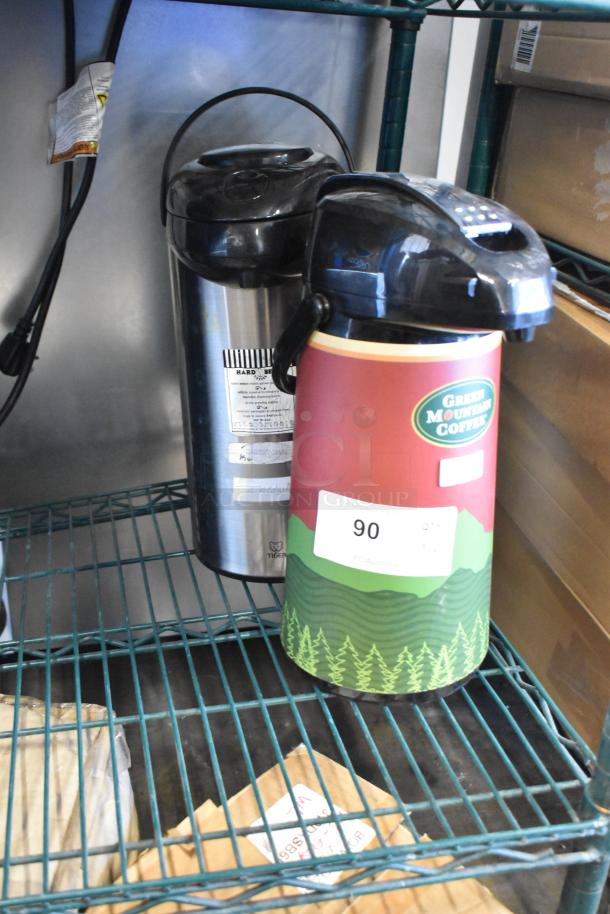 Two air pots on shelf; one labeled Green Mountain Coffee. Stainless steel and red design. Auction tag 90 visible.