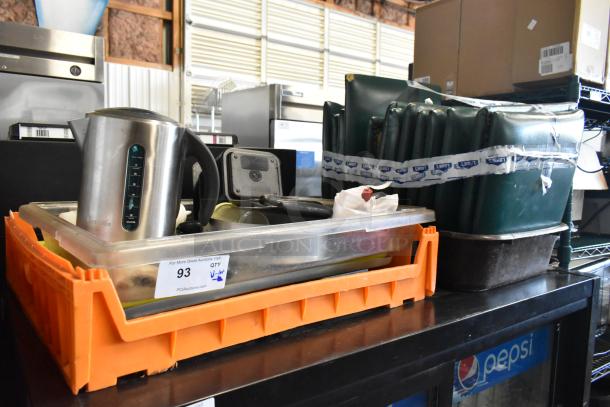 Lot of various items including a Breville electric kettle, metal rocking cutters, and a water pot, in used condition.