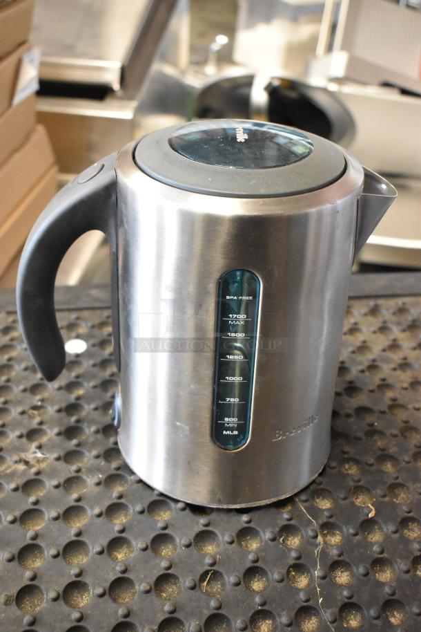 Breville electric kettle in stainless steel finish, with water gauge marked from 500 to 1700 mL, BPA free, good condition.