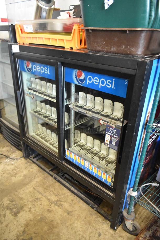 True GDM-41C-48 commercial 2-door cooler merchandiser with poly-coated racks, Pepsi branding, 115 volts, 1 phase.